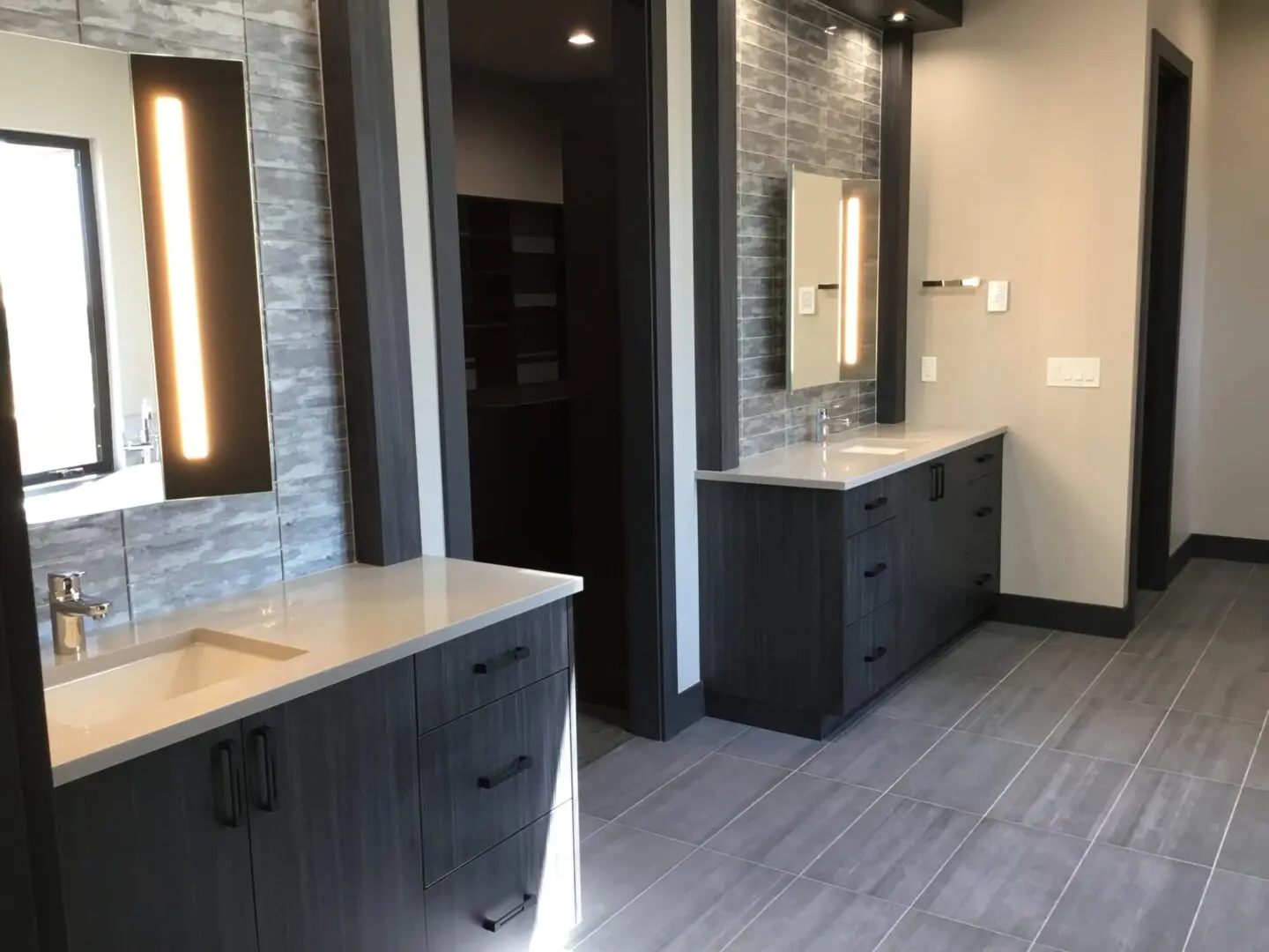 a bathroom with two separate sinks
