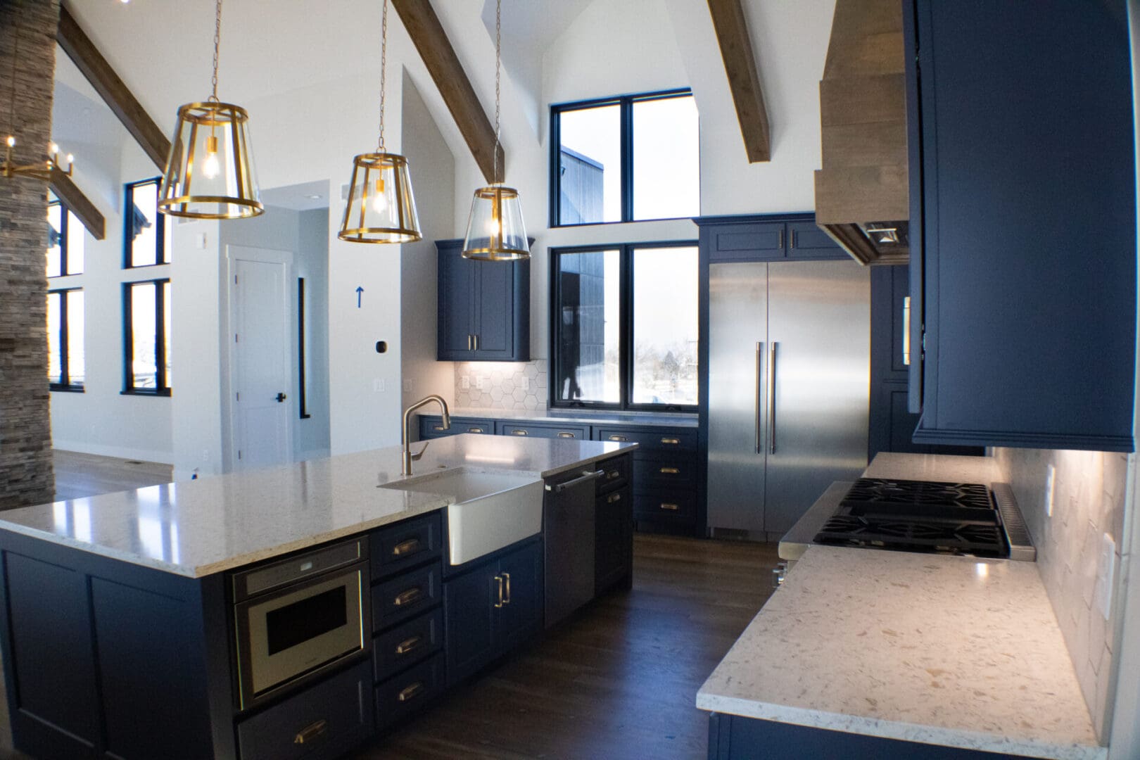 a kitchen with blue counters and modern appliances