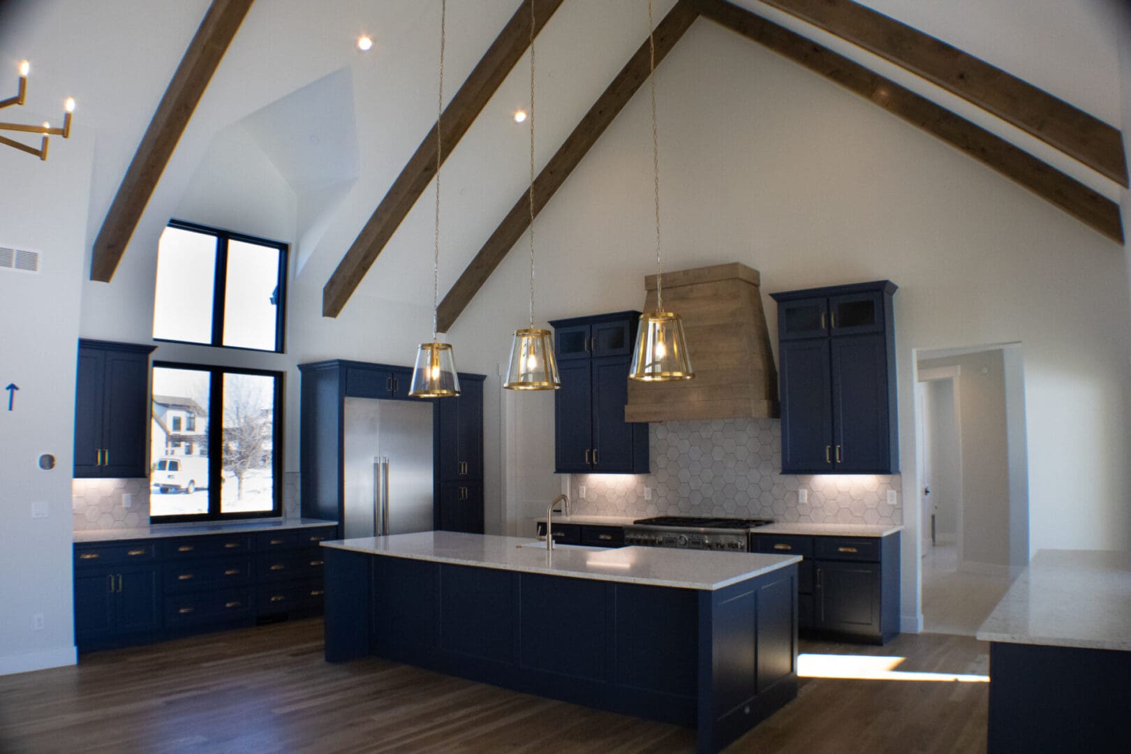 a kitchen with blue cupboards and counters and an island counter