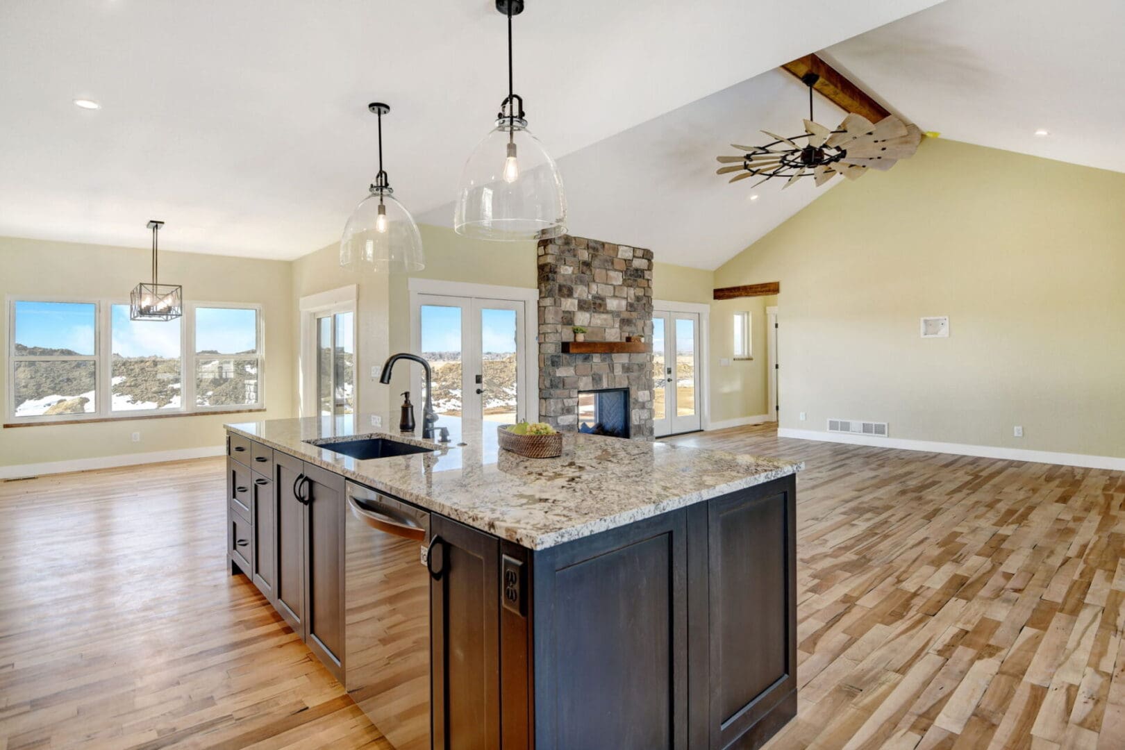 Kitchen island with sink and ceiling lights